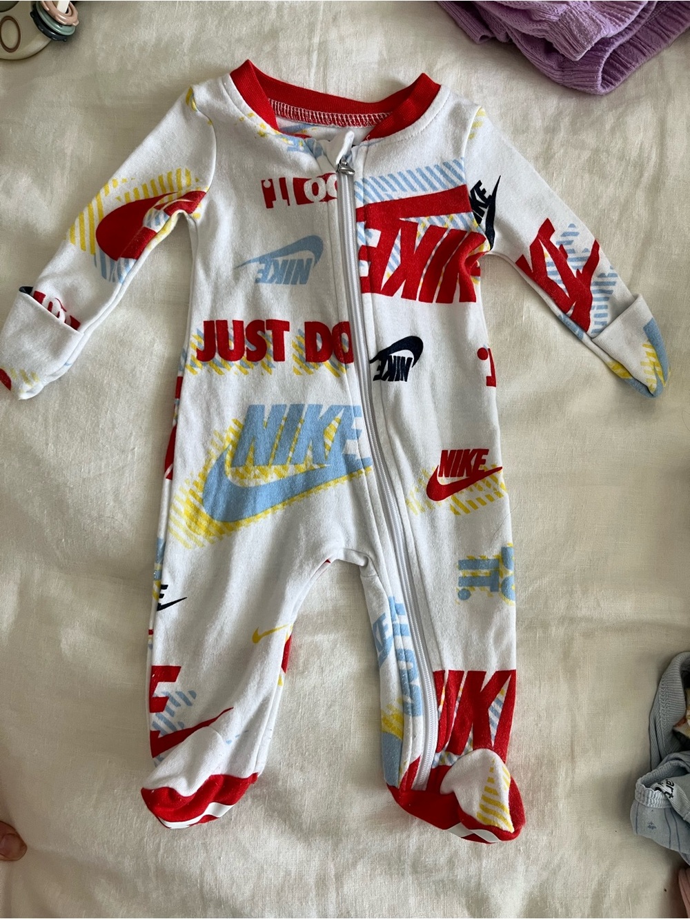 Nike footed onesie
